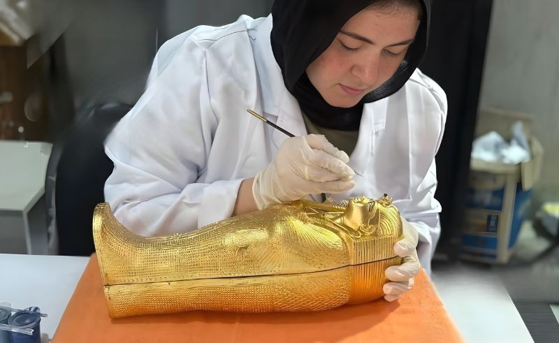 GEM’s Opening Invite Design Is a Gold-Gilded Miniature King Tut Coffin