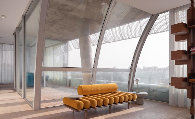 Curved Walls Define a Duplex Overlooking the Beirut Hippodrome